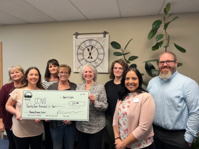 Employees from Community Bank presenting Community Connection of NE Oregon with check for $24,000. 