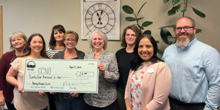 Employees from Community Bank presenting Community Connection of NE Oregon with check for $24,000. 